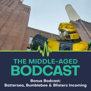 Promotional graphic for The Middle-aged Bodcast bonus episode "Battersea, Bumblebee & Blistens Incoming". A Bumblebee figure is pictured in front of Battersea Power Station, with the podcast name and title below on a navy and teal background.